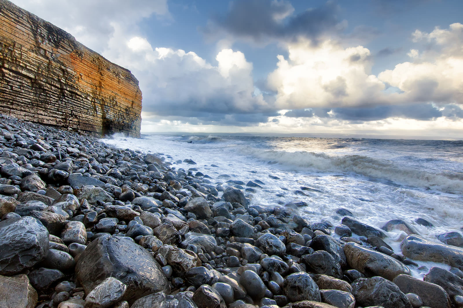 Sea breaking on to Nash Point in Wales.